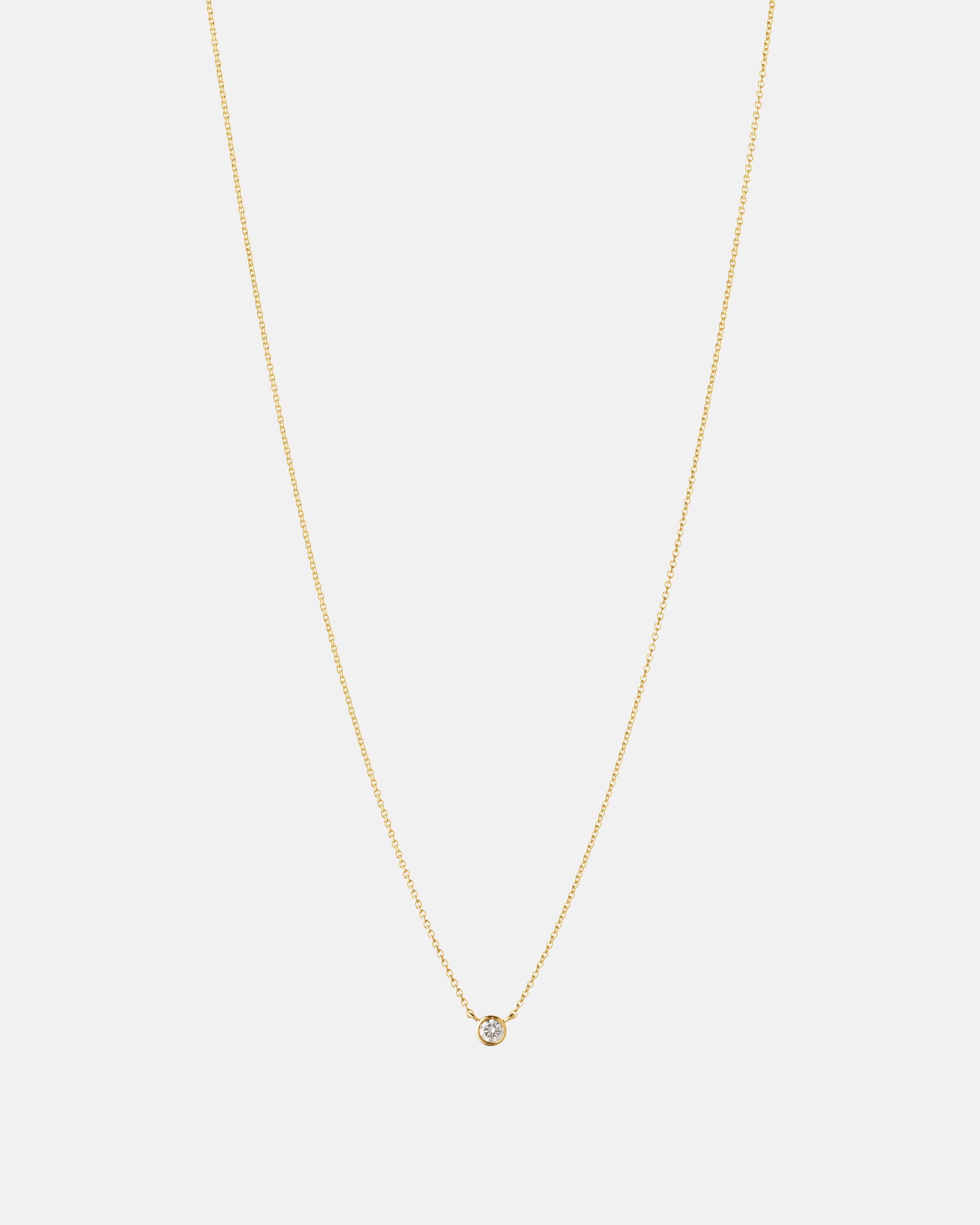 Produktbillede af Eclipse Solitaire halskæde i 14 kt guld på lys baggrund.